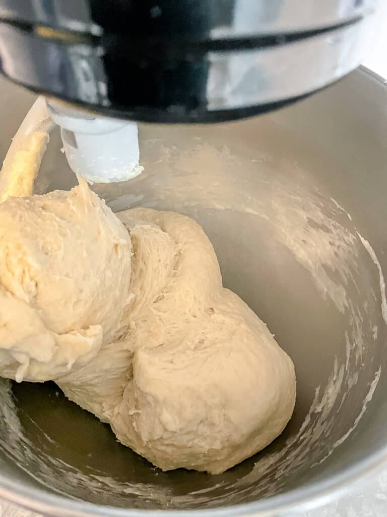 dough being pulled away from the side of the bowl