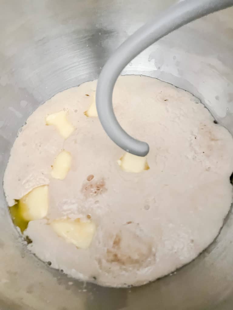 yeast and butter and water in a mixing bowl