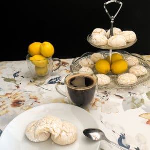 lemon cookies on a tiered platter with espresso