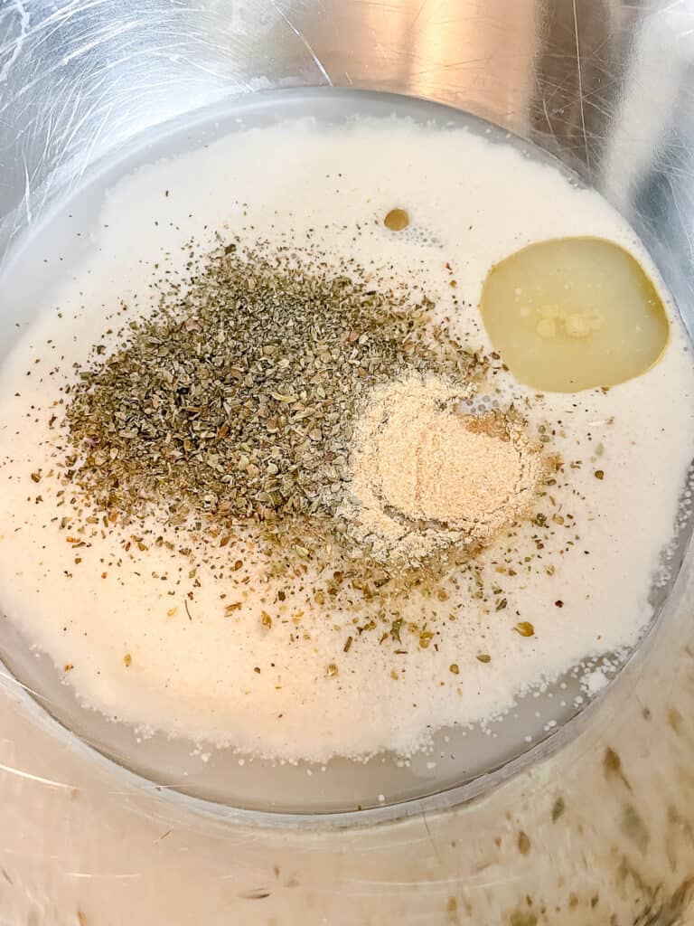 garlic and herb seasonings in a bowl for pizza dough