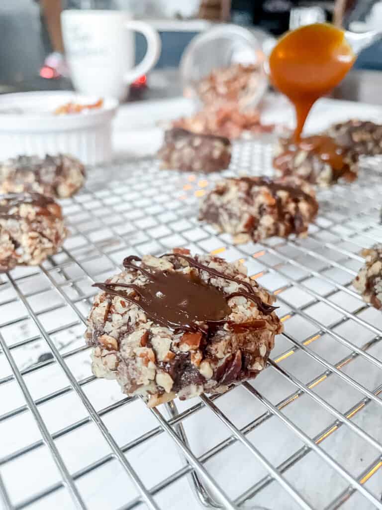 Chocolate Pecan Caramel Thumbprint Cookies on a baking sheet