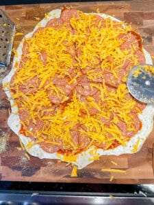 cheese on a pepperoni pizza