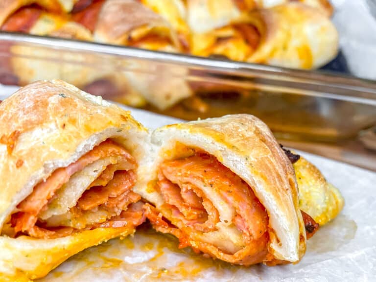 Pizza roll ups on a plate, an easy dinner idea for leftover shredded chicken