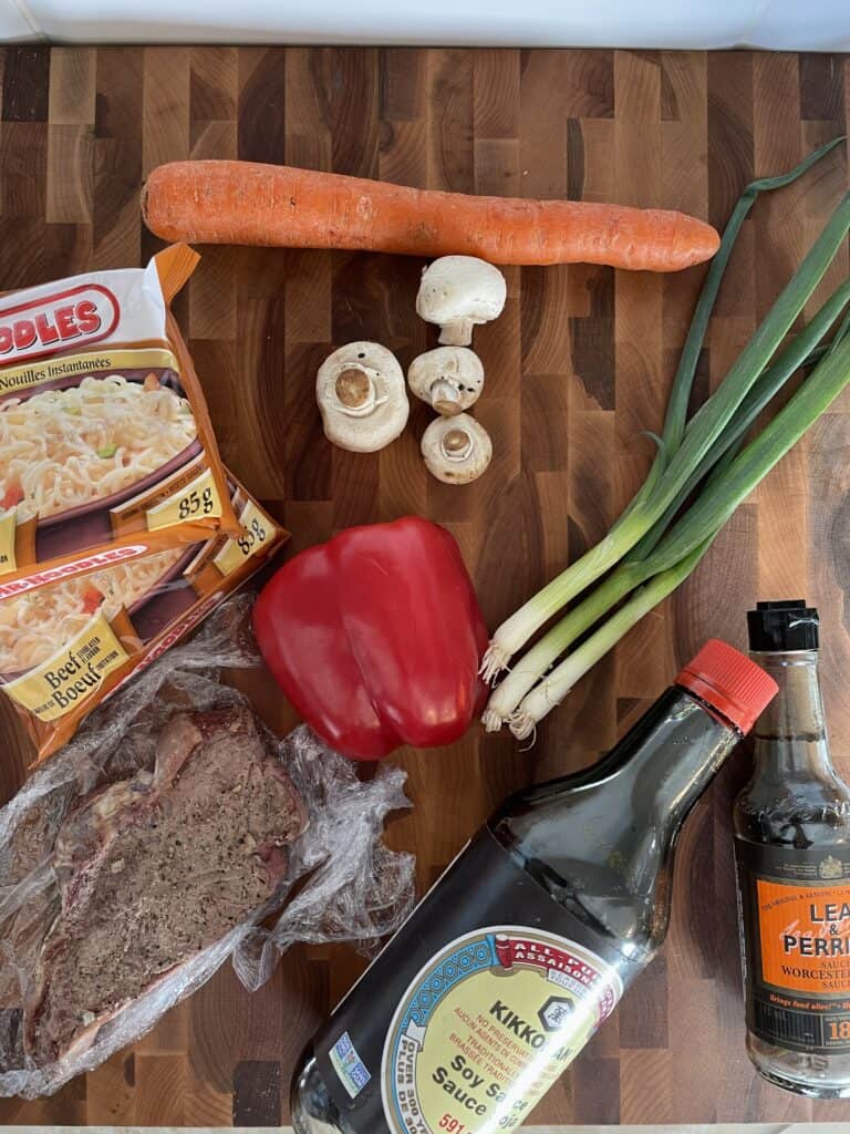Ingredients for steak ramen - Steak, Ramen Noodles, Carrot, Mushrooms, Pepper, Green Onion, Worcestershire Sauce and Soy Sauce
