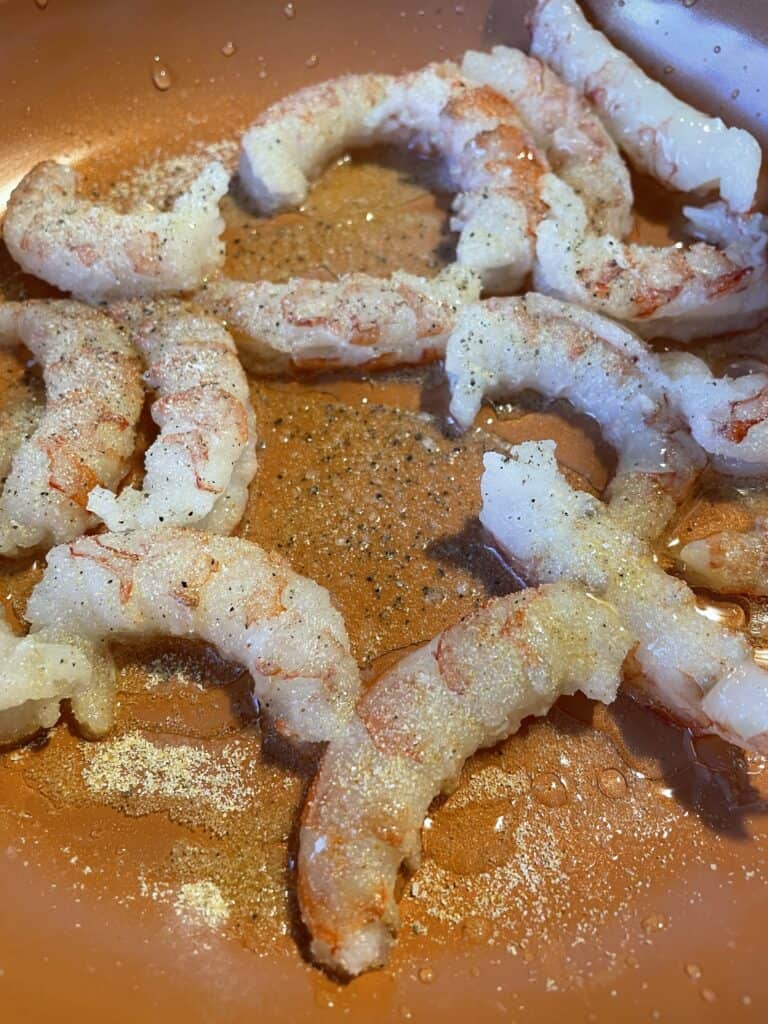 garlic seasoned shrimp in a frying pan