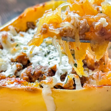 pizza Spaghetti Squash with a forkful being scooped out of it